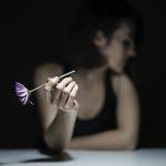woman holding flower